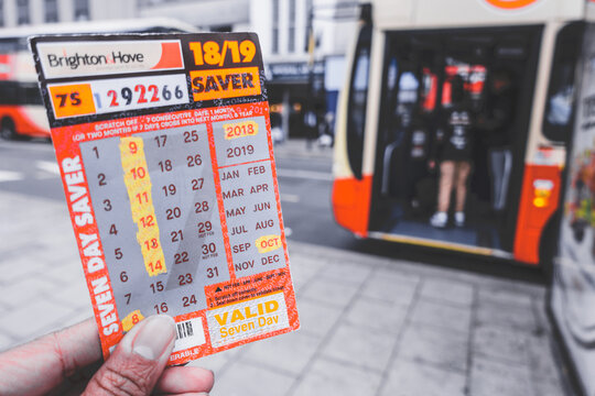 Brighton, England-1 October,2018: Student or tourism holding the Brighton & Hove seven day saver bus pass ticket inside the public bus route.