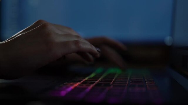 Software developer freelancer woman female hands work with program code C++ Java Javascript on wide displays at night Develops new web desktop mobile application or framework Projector background