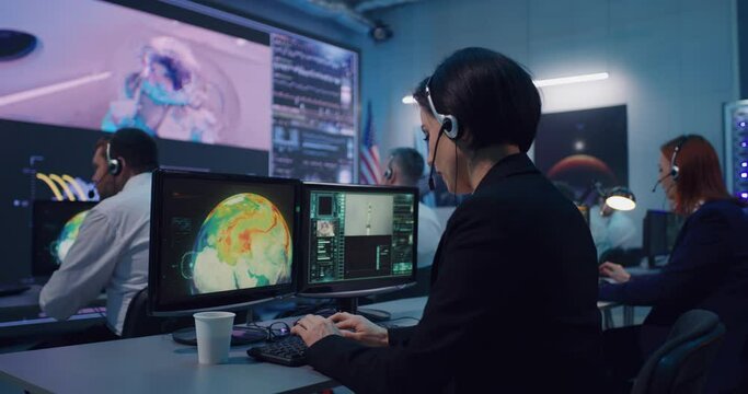 Flight operator using computer during spacecraft launch