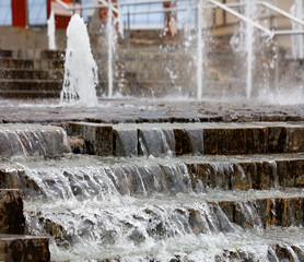 Running water through a cascading stepped fountain.