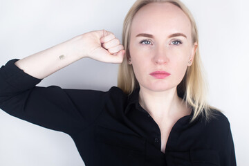 The woman shows his hand with a chip implanted. The concept of chipping and implantation of...