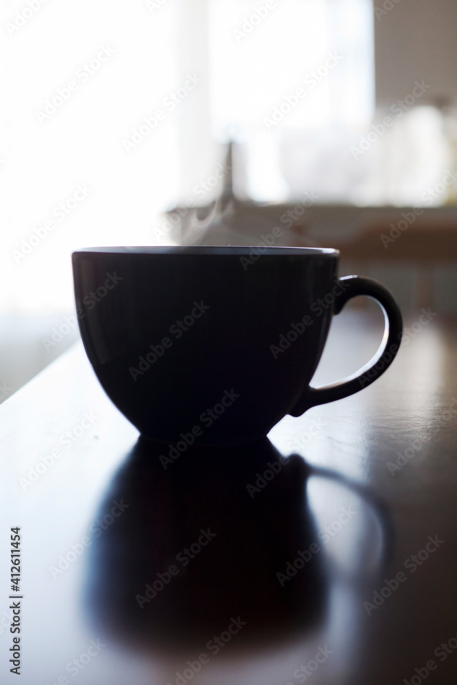 Wall mural cup of coffee on the table