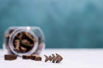 Dog treats spilling out of bowl. Dog treats and biscuits