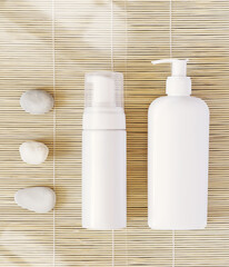 Flat lay with white cosmetics bottles and stones on a natural mat background. Mock up of natural beauty product. Spa, cosmetics flat lay in oriental stile. Bath home procedure