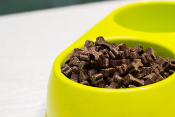 Bowl full of dog food over table 