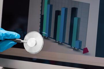 The technician applies a stethoscope to the laptop display. Problem analysis diagram. Computer repair shop concept.