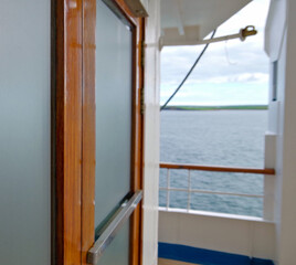 View over open outdoor deck of classic cruiseship or cruise ship liner at sea