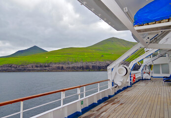 Sun loungers or deck chairs on outdoor boat or promenade deck of classic cruiseship or cruise ship...