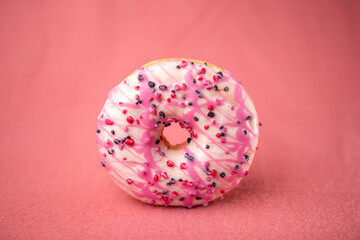 Pink donut on a pink background