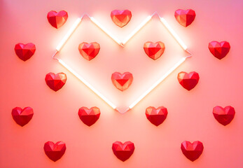 Abstract background pink background with geometric red hearts and heart shaped lamps shining. Holiday background for Valentines Day. Minimal style.