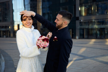bride and groom walking in the street © smirs
