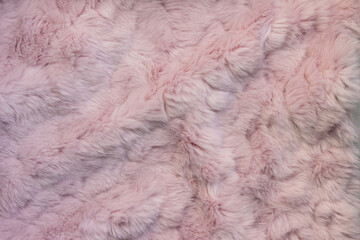 .Pastel pink fluffy fur background. Valentine's day minimal concept.