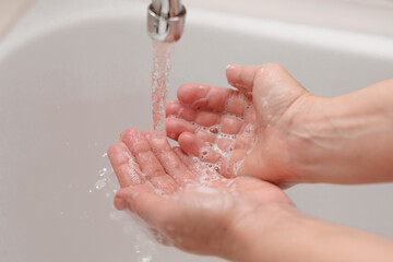 Fototapeta premium Hygiene. Cleaning Hands. Washing hands on sink.