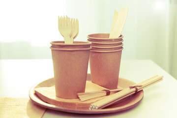 Natural eco-friendly bamboo and paper tableware. Recycling concept.