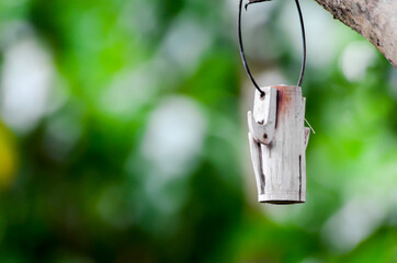 wooden item for decoration hanging on the branch