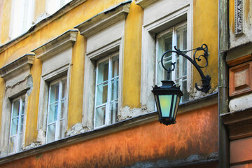 an old houses & an old lamp on the wall