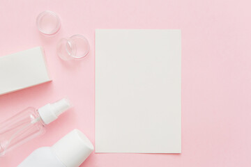 Skin care mockup. Beauty concept. Skin care products, bottles, spray and soap on pink background. Blank, copy space.