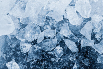 Ice pieces texture background. Crushed ice blue toned pattern.