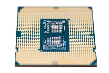 A macro photo of a modern CPU processor under the LGA 1200 socket on a green circuit board,...