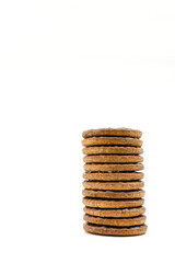 Stack of chocolate covered biscuits against a plain white background. No people. Copy space.