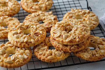 cookies with peanuts on a black wire rack. Selective focus, closeup.