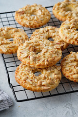 Cookies with peanuts on a black wire rack. Selective focus, closeup.