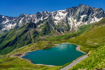 Naklejka na ściany i meble Passo Gavia, mountain pass in Lombardy, Italy, to Val Camonica at summer. Lake