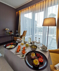 Luxurious breakfast for the newlyweds at the hotel. Breakfast in the room