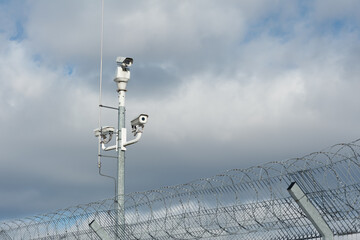 A video surveillance system with a barbed wire fence