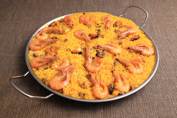 Valencian seafood paella in paellera