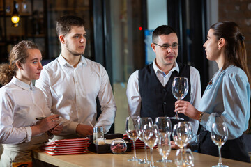 the manager trains the restaurant staff on the rules of customer service