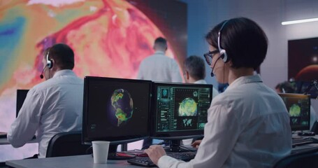 Female ecologist using computer and talking