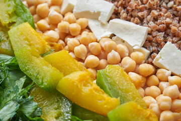 Food bowl with chickpeaks. Health dinner. Vegetarian cooking cuisine. Cafe organic meal. Fresh lunch with pumpkin and feta cheese. Detox spicy. Above view. Flatlay. Closeup