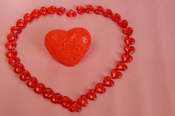 Heart reddish big heart on a pink background. Postcard for lovers, Valentine's day, wedding.