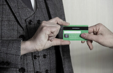 Anonymous businessman holding credit card as safe payment concept  .