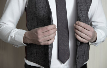 Businessman in classic vest and tie.