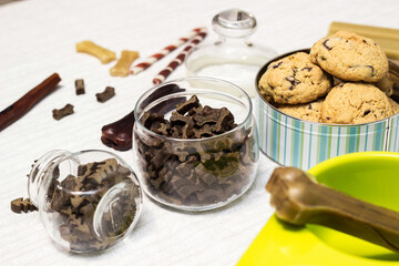 Dog treats spilling out of bowl. Dog treats and biscuits
