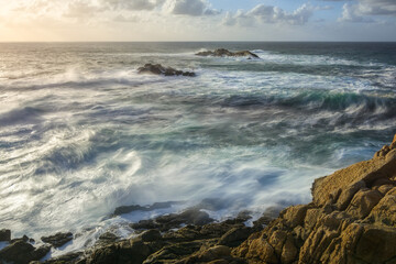 Sunset over the wild blue ocean