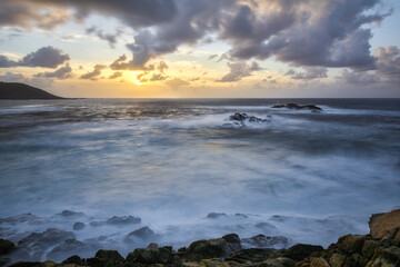 Fototapeta na wymiar Sunset over the wild blue ocean