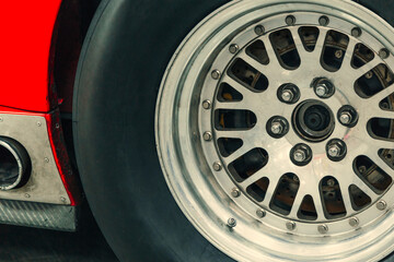 Car wheel on the car - close-up. tire and body part