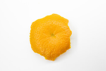 orange peel isolated on a white background. Single orange skin. Tangerine peel on the white table....