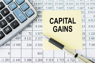 Text capital gain on the short note texture background, business concept
