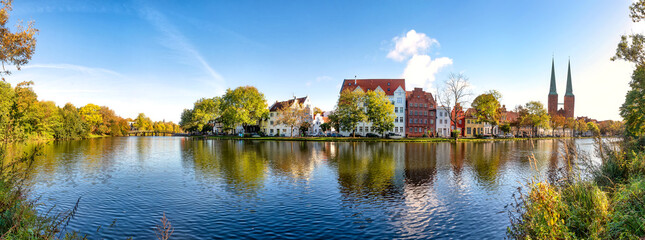 Panoramic view over the Muehlenteich pond to the buildings and Cathedral of Lübeck at the Baltic Sea, Schleswig-Holstein, Germany