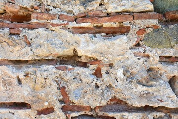 Medieval destroyed stones.  Old historical bricks.  Ancient cobblestone path. Destroyed building in Ayasuluk Castle, Turkey. Selective focus. Abstract grunge background 