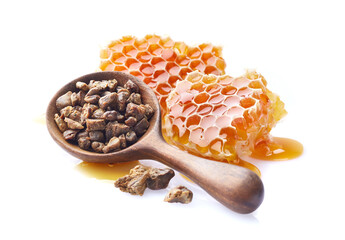 Honeycombs with propolis granules on white background