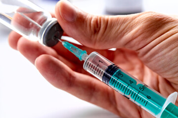  Vaccine in vial with syringe