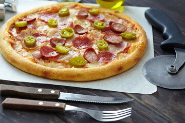 tasty pizza on the wooden background