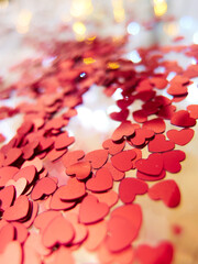 hearts confetti on the golden background