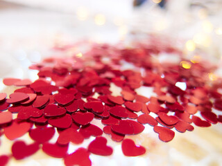 hearts confetti on the golden background