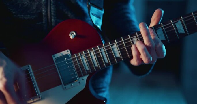 Guitarist playing electric guitar on stage